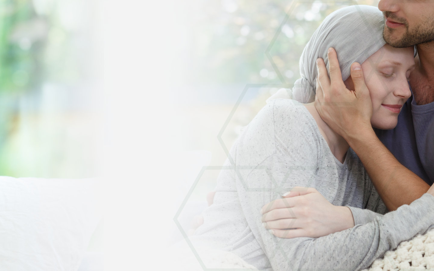 Image of woman being help by a man in a hospice