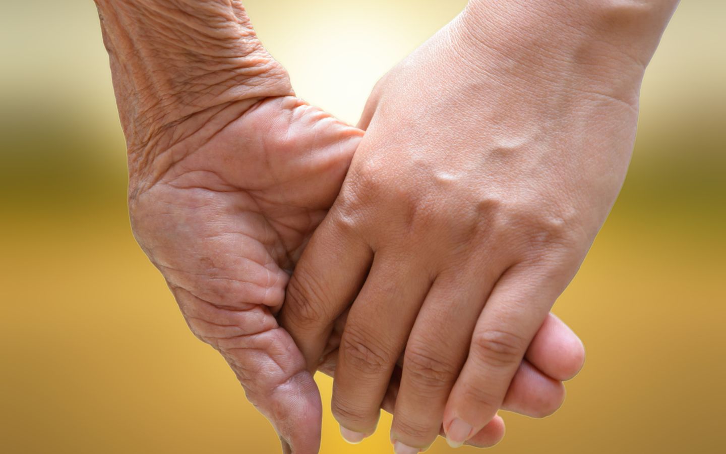 Two people holding hands